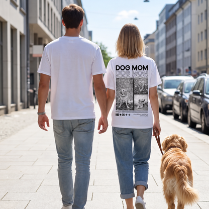Zwei Personen gehen hand in hand auf einer Straße, die Frau trägt ein T-Shirt mit dem Aufdruck "DOG MOM".