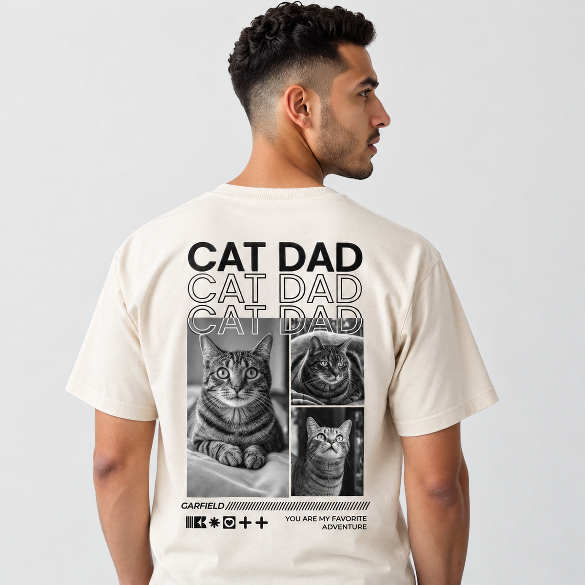 Beige T-Shirt mit Katzen-Motiv und Schriftzug "CAT DAD" auf der Rückseite.