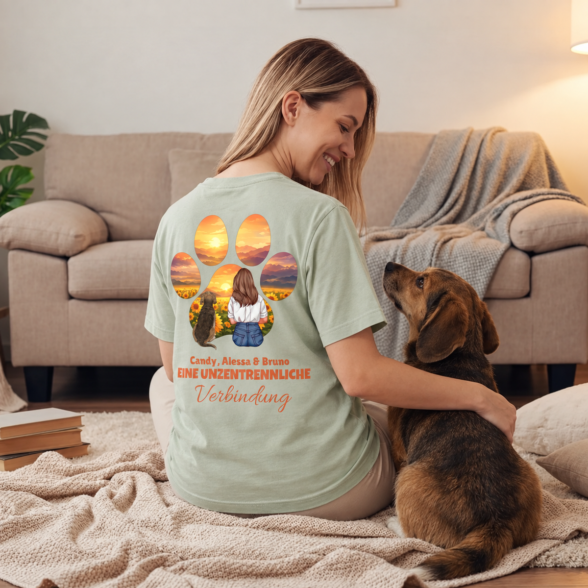 Grünes T-Shirt mit personalisiertem Design, großem Pfotenmotiv und einer Frau mit Hund im Sonnenblumenfeld.