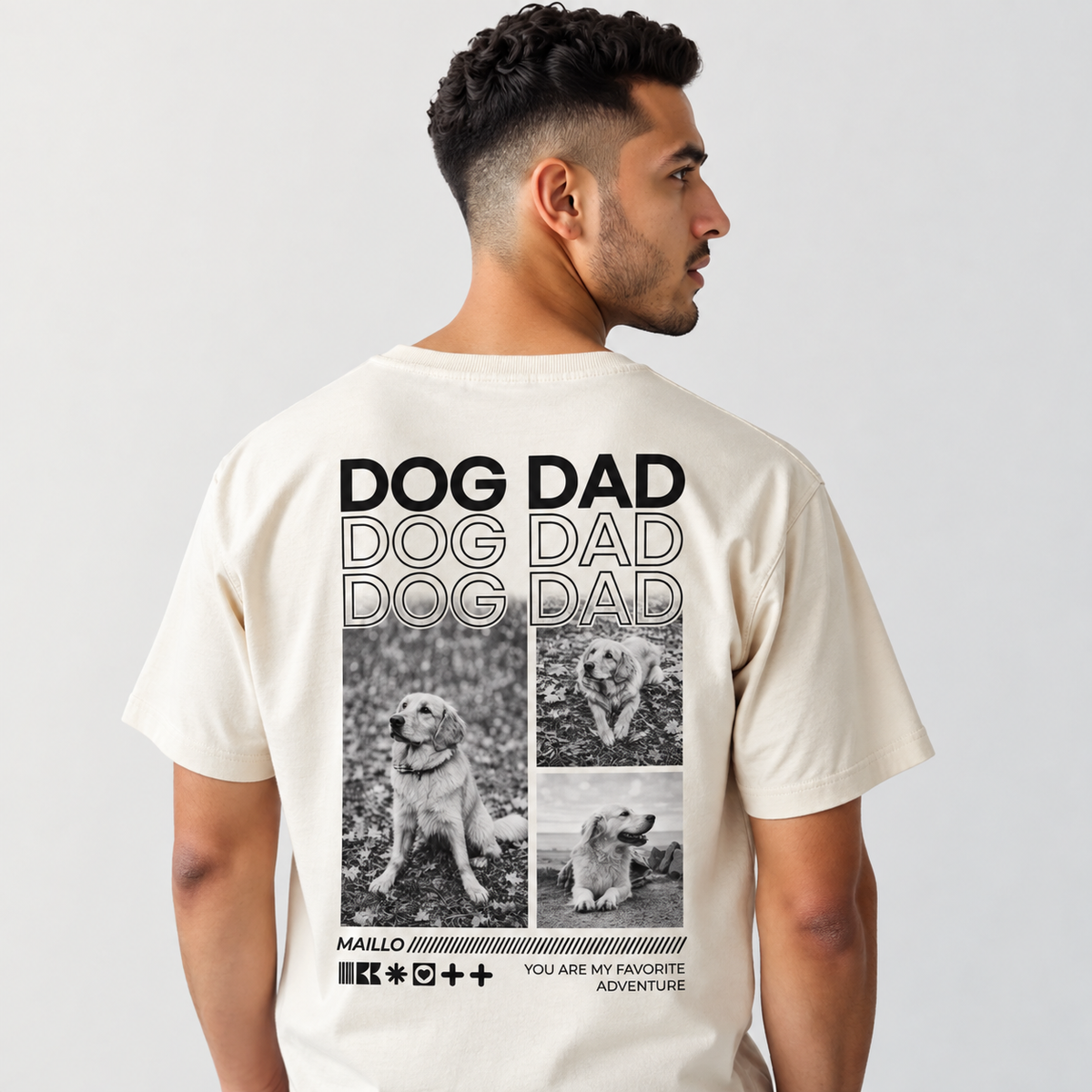 Beige T-Shirt mit "DOG DAD"-Grafik und schwarzen Fotos von Hunden auf der Rückseite.