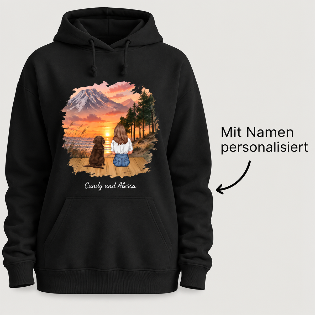 Schwarzer Hoodie mit personalisierter Illustration einer Person mit Hund vor Sonnenuntergang.