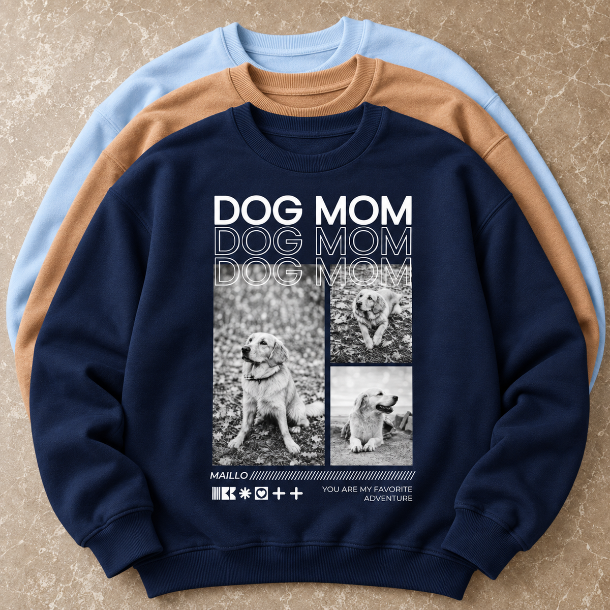 Dunkelblaues Sweatshirt mit "Dog Mom" Druck und Bildern von Hunden, in einer Gruppe von drei Sweatshirts.