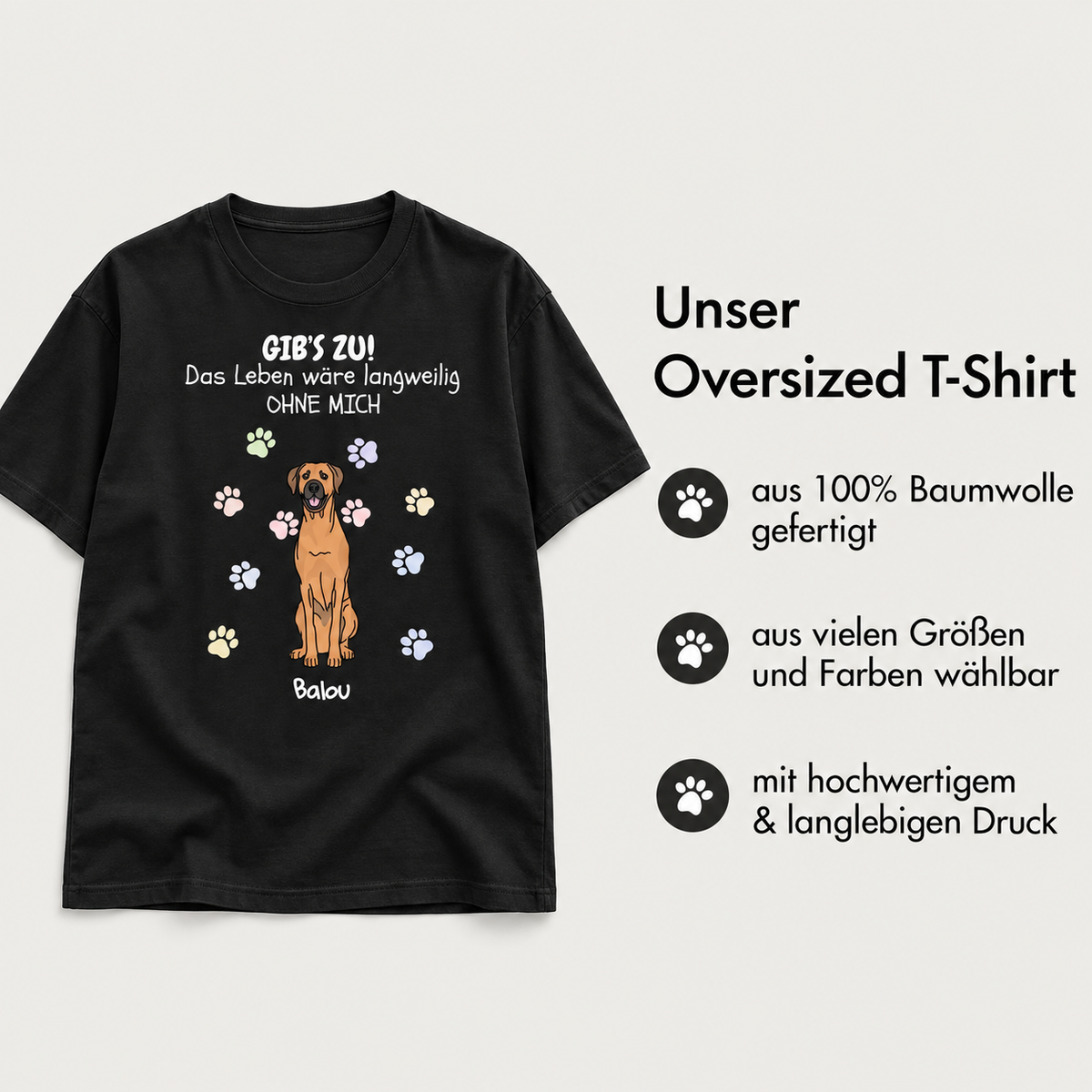 Schwarzes oversized T-Shirt aus 100% Baumwolle mit Hundedesign und bunten Pfotenabdrücken.