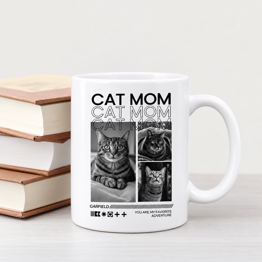 Weiße Tasse mit "Cat Mom" Schriftzug und Schwarz-Weiß-Bildern von Katzen, gestapelt neben einem Buchstapel.