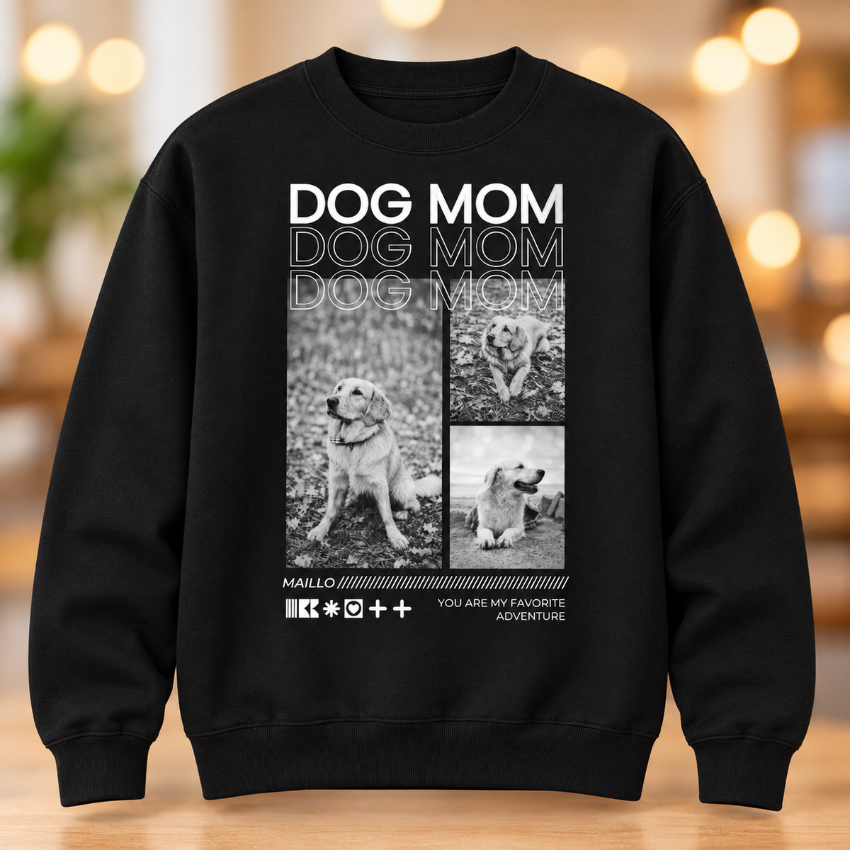Schwarzes Sweatshirt mit dem Aufdruck "Dog Mom" und Hundebildern in Schwarz-Weiß.