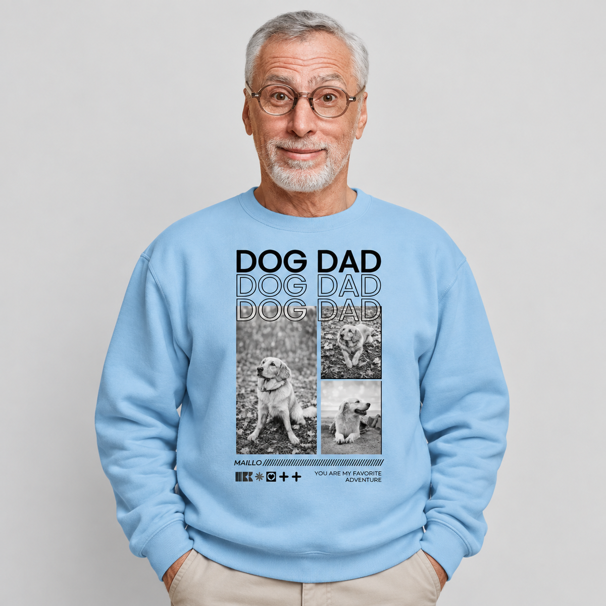Helles, blaugraues Sweatshirt mit Aufdruck "Dog Dad" und Bildern von Hunden.