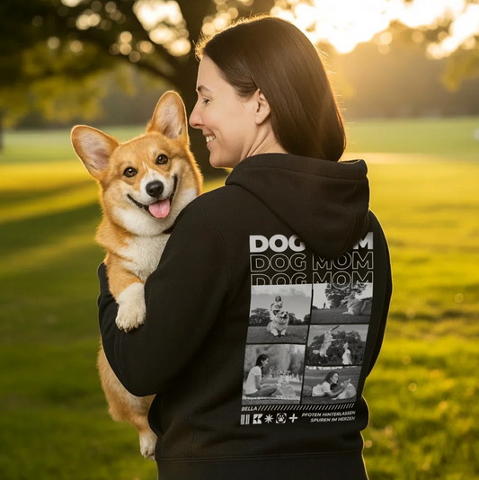 Schwarzer Hoodie mit dem Aufdruck "Dog Mom" und Bildern von Hunden. Trägerin hält einen Corgi in der Hand.